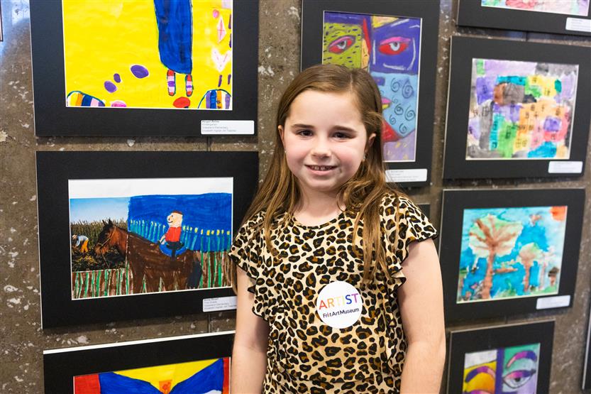 Students and their family at an art show